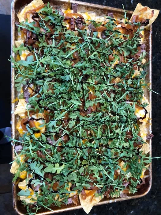 Grilled Steak, Onions & Arugula nachos from our kitchen