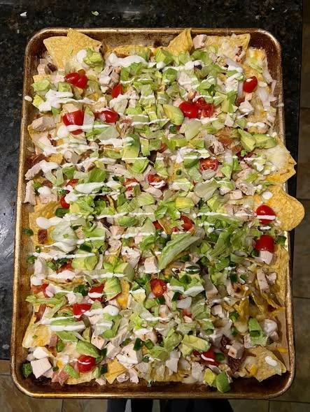 Cheeseburger Meets Chicken Bacon Ranch nachos from our kitchen